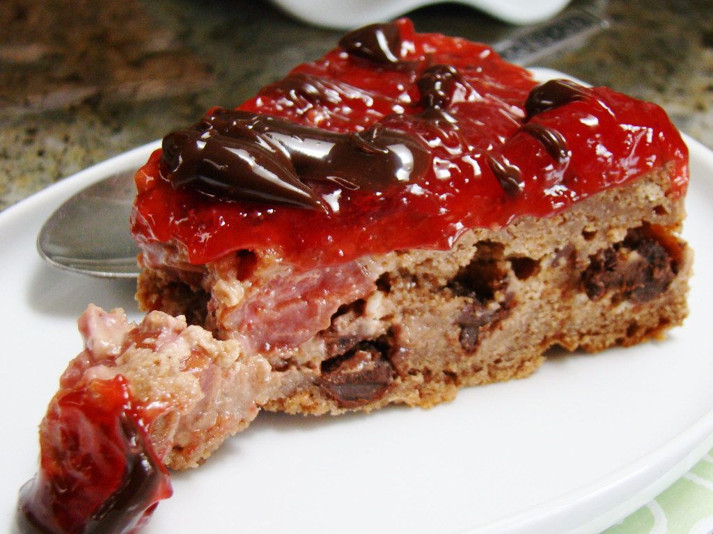 A photo of cherry chocolate cake slice