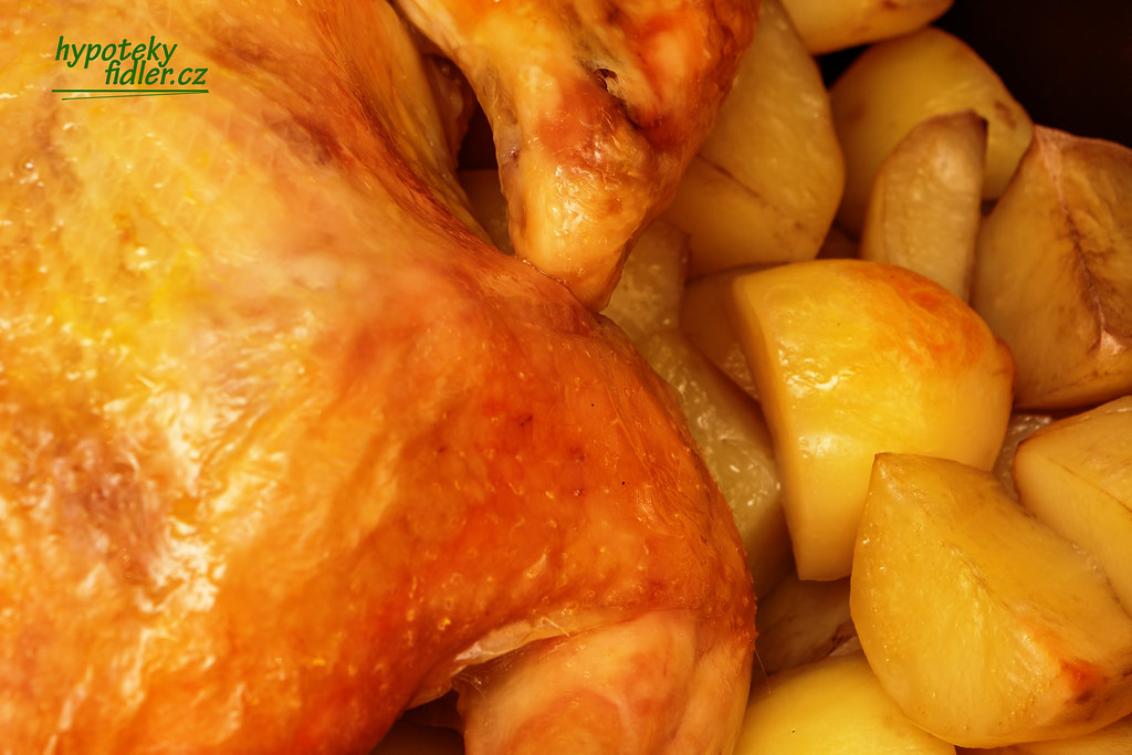 Golden roast chicken with roasted potatoes