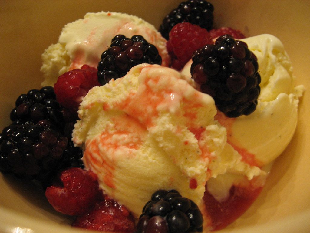 A photo of whipped cream fruit dessert