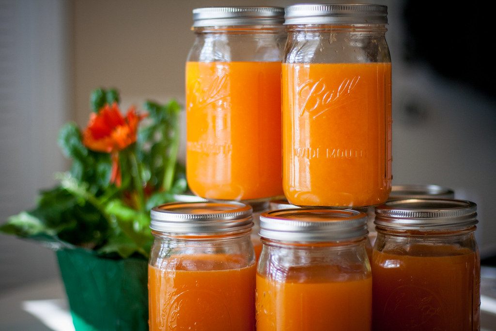 A photo of orange marmalade jars